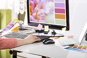 Graphic designer at work. Color samples.